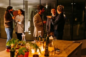 Professionals talking at an evening networking event